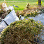 Big,White,Bags,Filled,With,Organic,Green,Garden,Waste,After